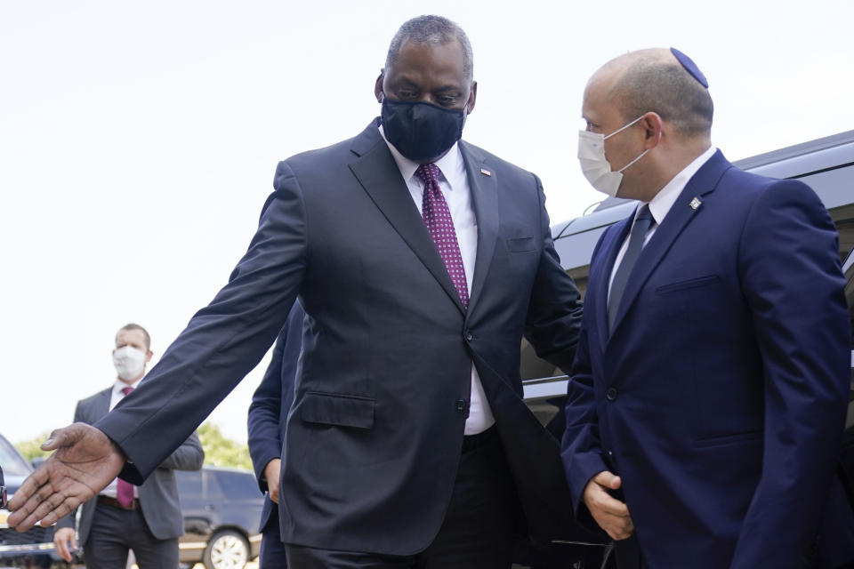 Secretary of Defense Lloyd Austin greets Israeli Prime Minister Naftali Bennett during an honor cordon upon his arrival at the Pentagon in Washington, Wednesday, Aug. 25, 2021. (AP Photo/Andrew Harnik)