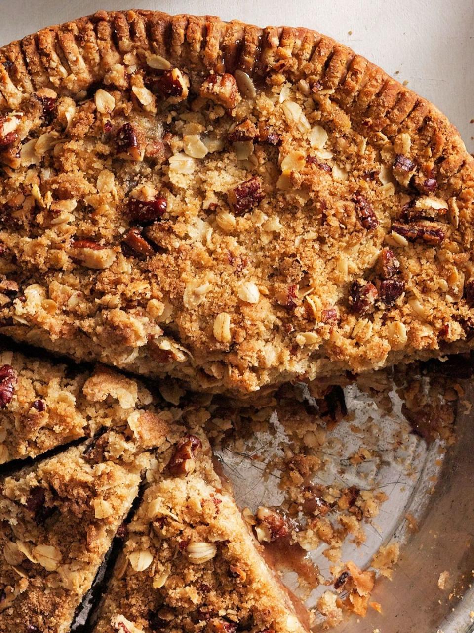 pear crumb pie in a metal pie tin and cut into slices