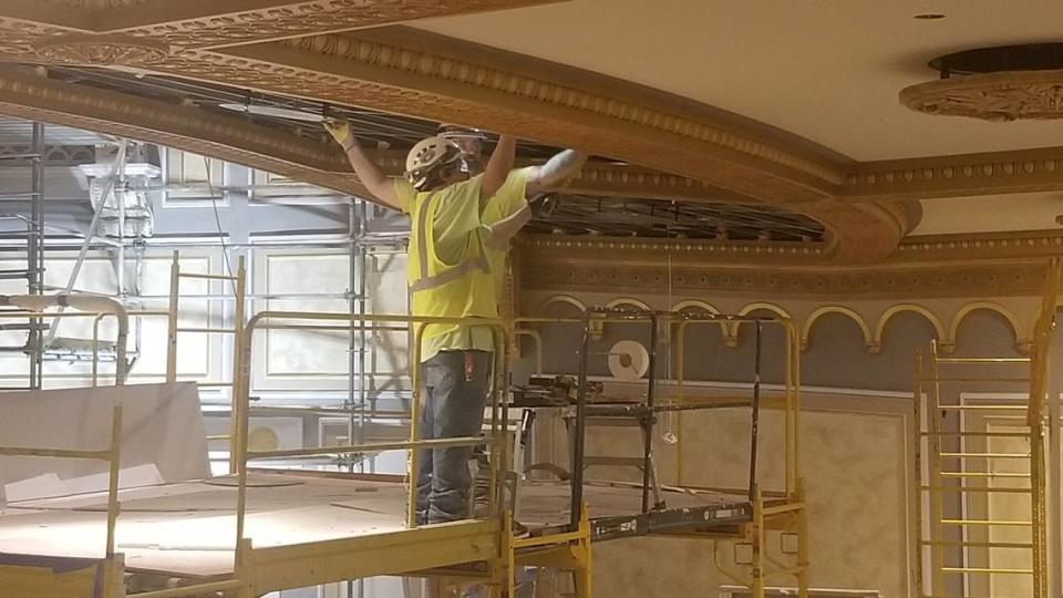 Construction workers renovate sections of a ceiling at the historic Carolina Theatre. It’s scheduled to re-open in 2025.