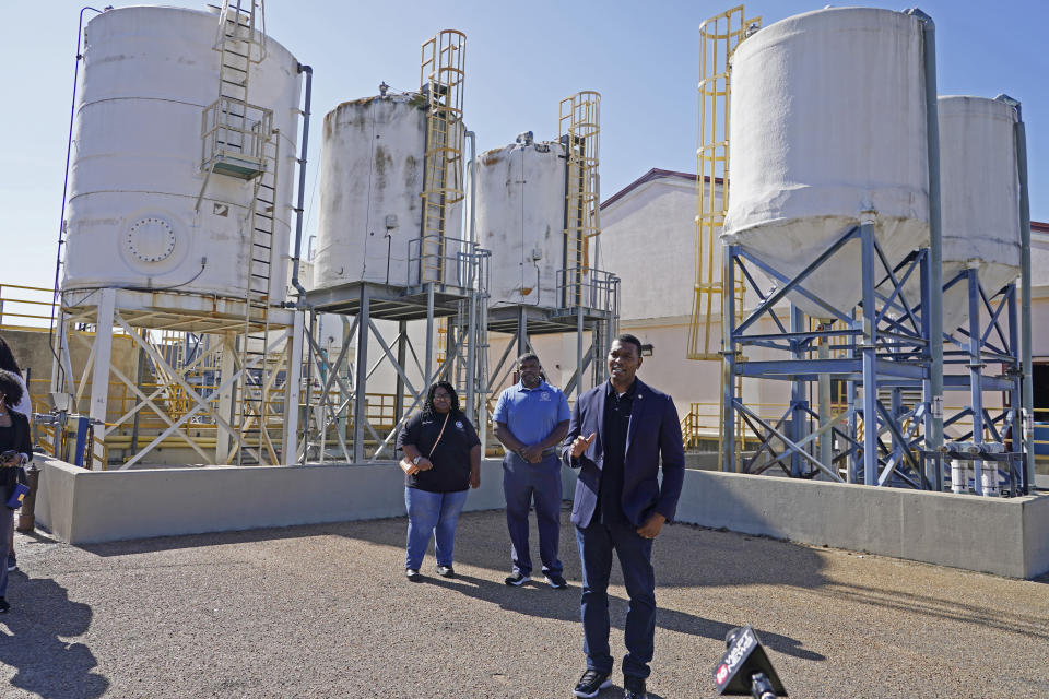 EPA Administrator Michael Regan, right, speaks to reporters at the O.B. Curtis Water Treatment Plant, a Ridgeland based facility near Jackson, Miss., about longstanding water issues that have plagued the city, Monday, Nov. 15, 2021. The visit was one of several stops in a week-long "Journey to Justice" tour through Mississippi, Louisiana, and Texas, spotlighting longstanding environmental concerns in historically marginalized communities. (AP Photo/Rogelio V. Solis)