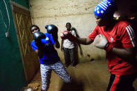 Sahar Mohamed Al Dooma (R), 26, challenges Saraa Mutawkil, 18, during boxing practice at Al Rabie club in Omdurman May 10, 2016. REUTERS/Mohamed Nureldin Abdallah