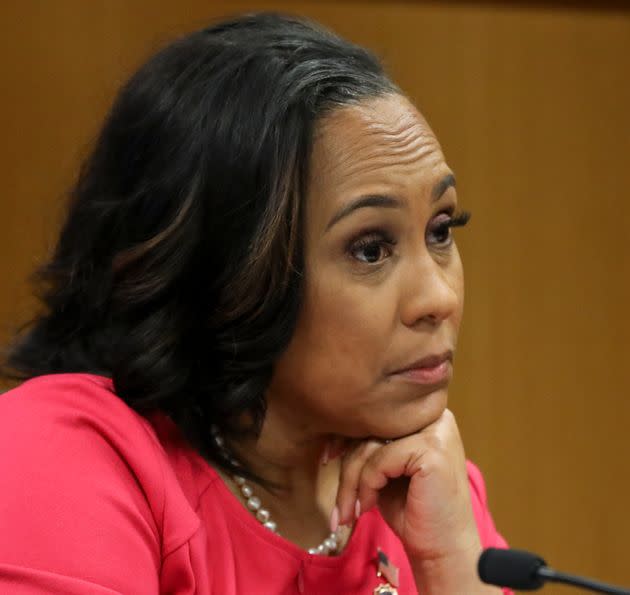 Fulton County District Attorney Fani Willis testifies during a hearing in the case of the State of Georgia v. Donald John Trump at the Fulton County Courthouse on Feb. 15 in Atlanta. Judge Scott McAfee is hearing testimony on whether Willis and special prosecutor Nathan Wade should be disqualified from the case for allegedly lying about a personal relationship.