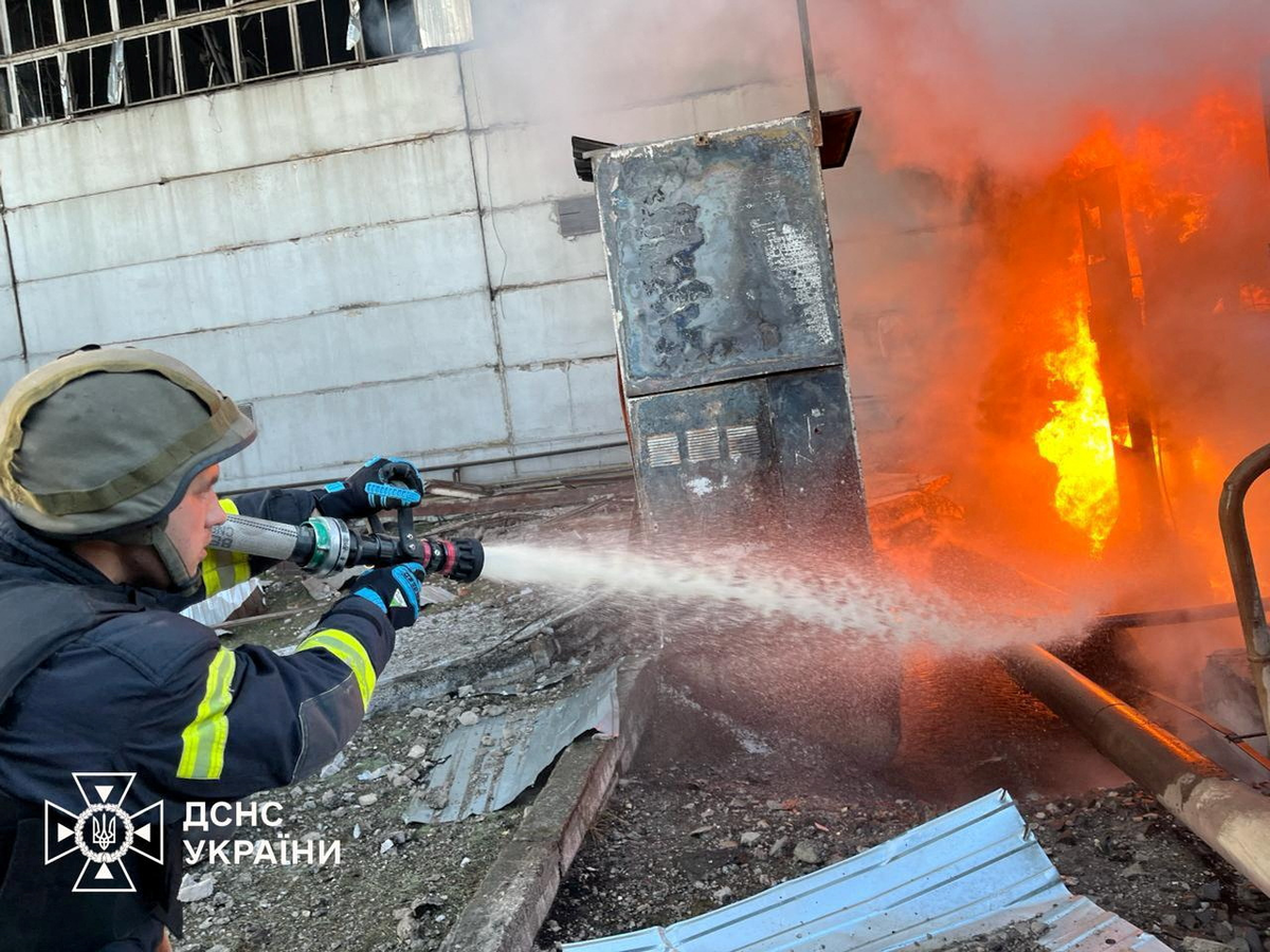 A firefighter battles a blaze at a a compound of power infrastructure facilities (via REUTERS)