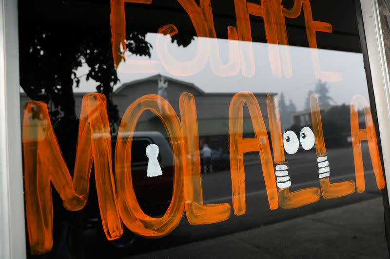 painted sign is seen inside a store during the aftermath of the Riverside Fire in Molalla, Oregon