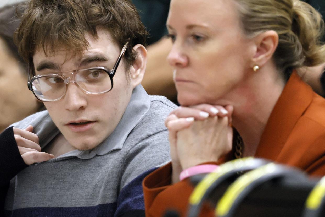 Marjory Stoneman Douglas High School shooter Nikolas Cruz is shown at the defense table with Assistant Public Defender Melisa McNeill as the verdicts are read in his trial at the Broward County Courthouse in Fort Lauderdale, Fla. on Thursday, Oct. 13, 2022.