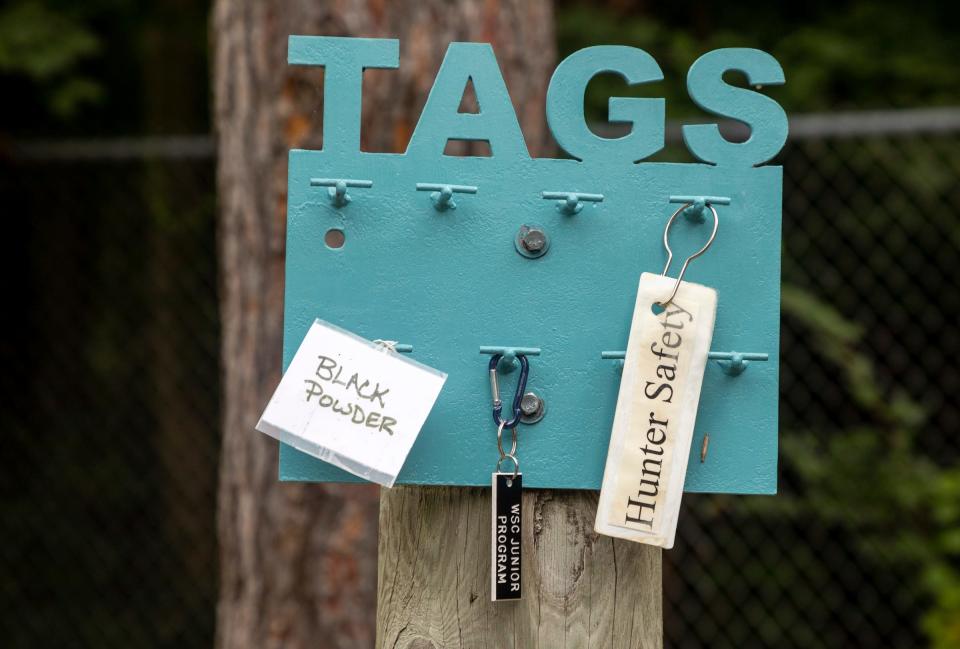 A hunter safety tag hangs alongside others during a Hunter Safety Field Day at the Washtenaw Sportsman's Club in Ypsilanti on Saturday, Sept. 9, 2023.