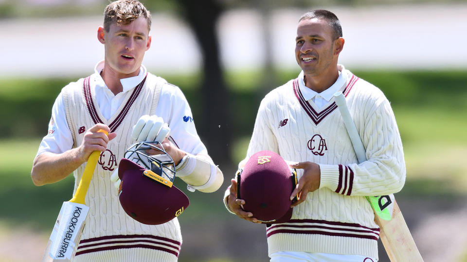 Marnus Labuschagne and Usman Khawaja, pictured here walking from the field after Queensland's win over South Australia.