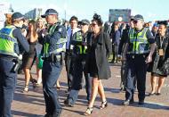 <p>Police had to escort some revellers from the racecourse.</p>