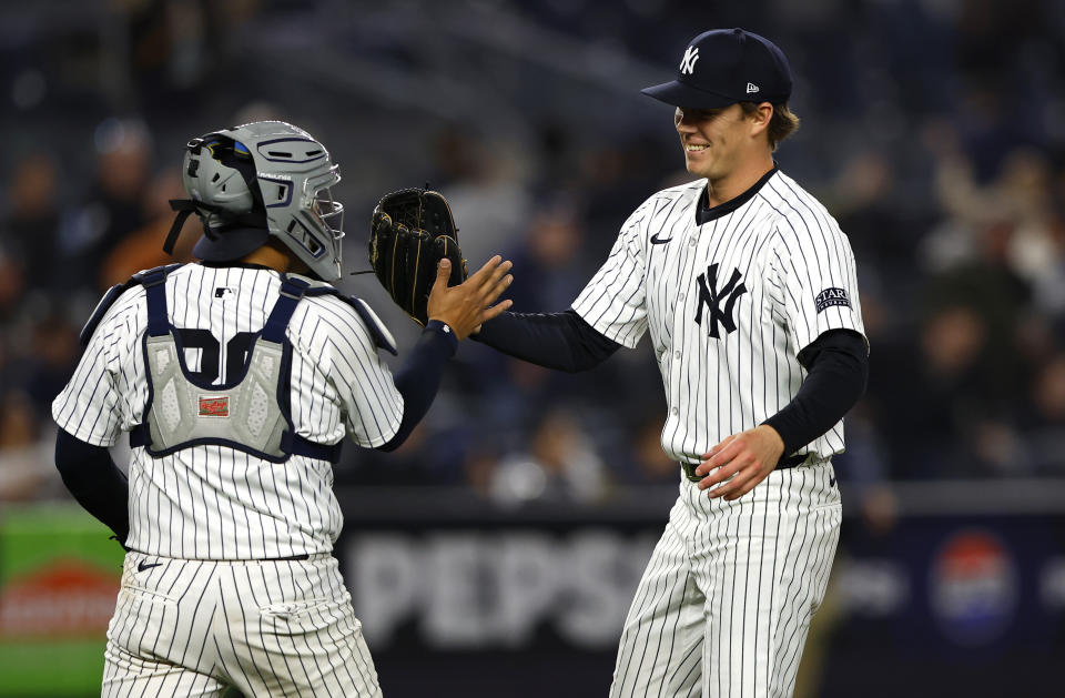 New York Yankees catcher Jose Trevino, left, shakes hands with Josh Maciejewski, right, after they defeated the Miami Marlins, Monday, April 8, 2024, in New York. (AP Photo/Noah K. Murray)