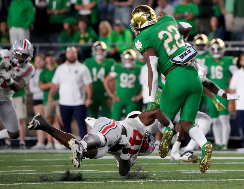 Ohio State safety Josh Proctor tackles Notre Dame running back Devyn Ford during the second quarter.