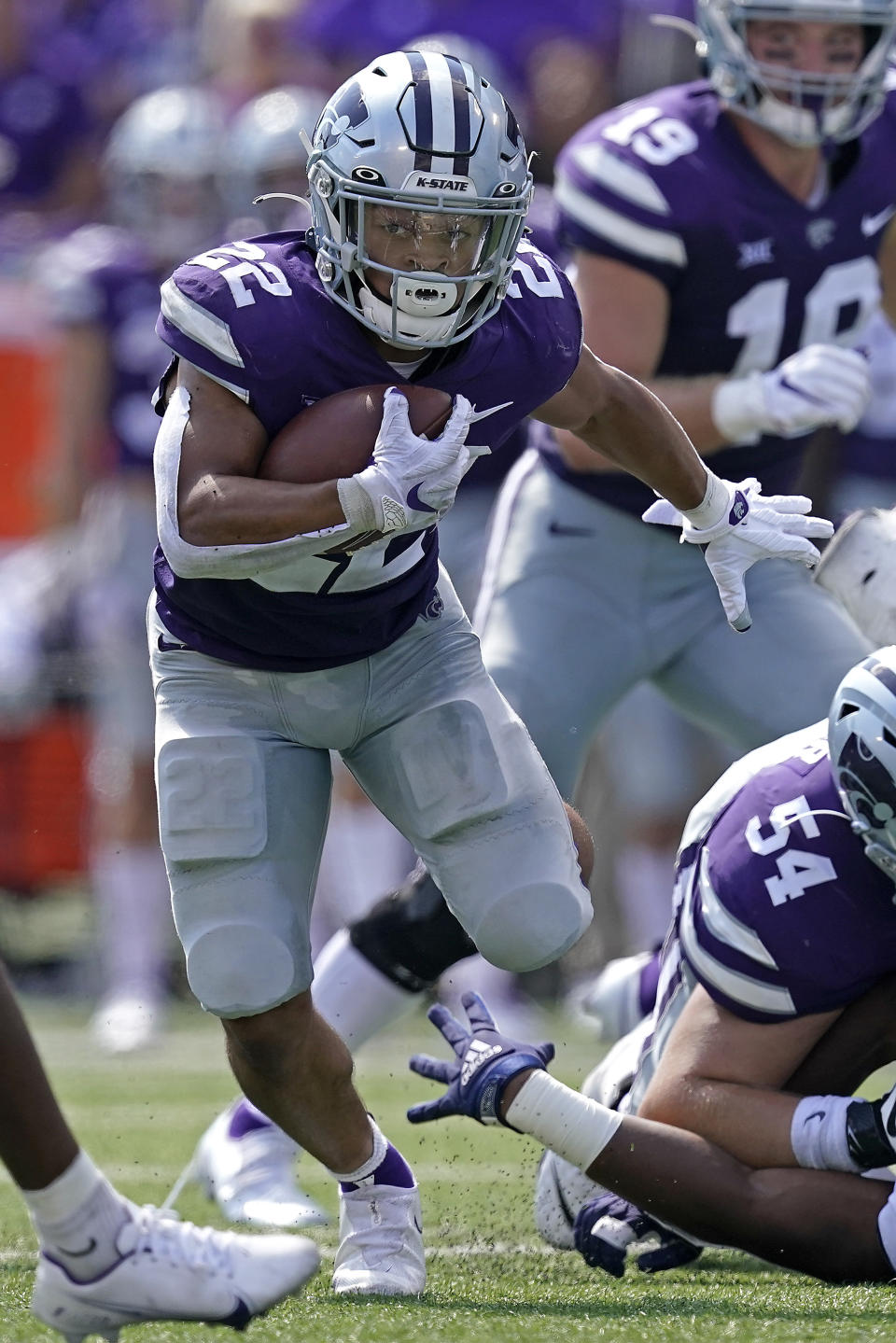 Kansas State running back Deuce Vaughn (22) run for a first down during the first half of an NCAA college football game against Nevada on Saturday, Sept. 18, 2021, in Manhattan, Kan. (AP Photo/Charlie Riedel)