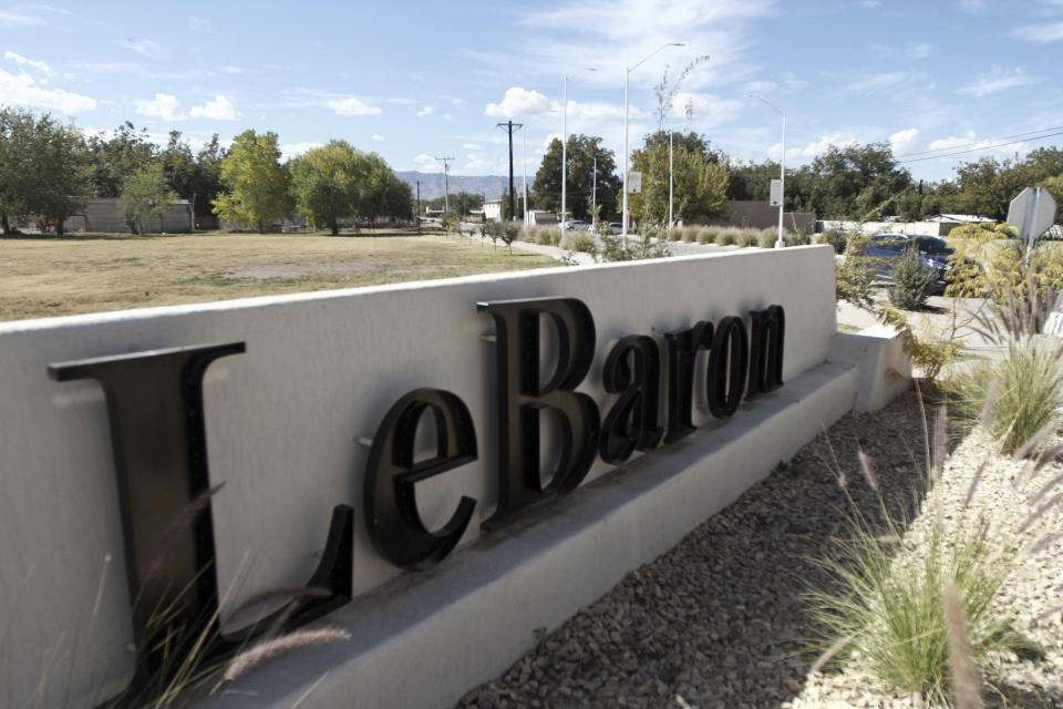 A sign announces the entry to Colonia LeBaron, one of many locations where the extended LeBaron family lives in the Galeana municipality of Chihuahua state, Mexico, Tuesday, Nov. 5, 2019. Drug cartel gunmen ambushed on Monday three vehicles along a road near the state border of Chihuahua and Sonora, slaughtering at least six children and three women from the extended LeBaron family, all of them U.S. citizens living in northern Mexico, authorities said Tuesday. (AP Photo/Christian Chavez)