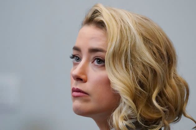 Actor Amber Heard listens in the courtroom at the Fairfax County Circuit Courthouse in Fairfax, Virginia, on May 23, 2022.  (Photo: STEVE HELBER via Getty Images)