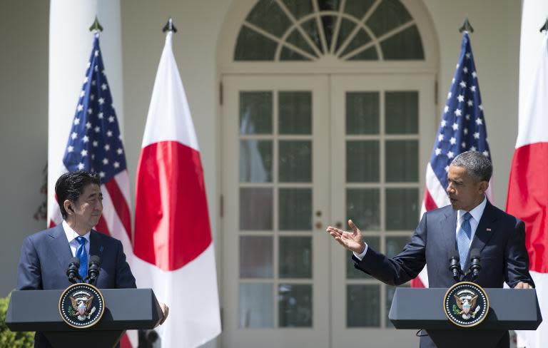 US President Barack Obama and Japanese Prime Minister Shinzo Abe hold a joint press conference in the Rose Garden of the White House in Washington, DC, April 28, 2015