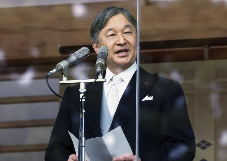 Japan's Emperor Naruhito addresses from the balcony of the Imperial Palace to well-wishers in Tokyo on Friday, Feb. 23, 2024. Emperor Naruhito turns 64 on Friday. (Yoshikazu Tsuno/Pool Photo via AP)