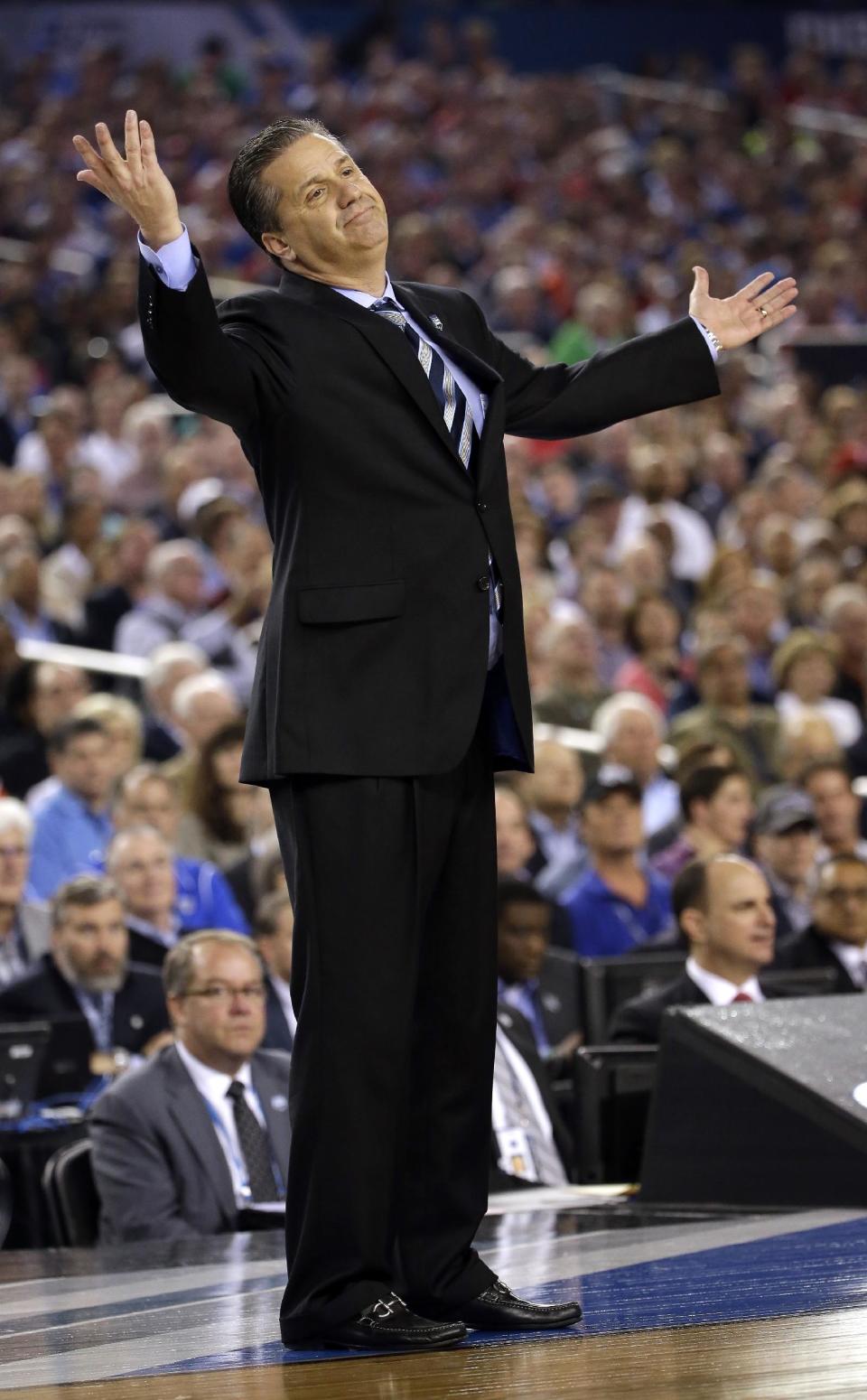 Kentucky head coach John Calipari reacts during the first half of the NCAA Final Four tournament college basketball championship game against Connecticut Monday, April 7, 2014, in Arlington, Texas. (AP Photo/David J. Phillip)