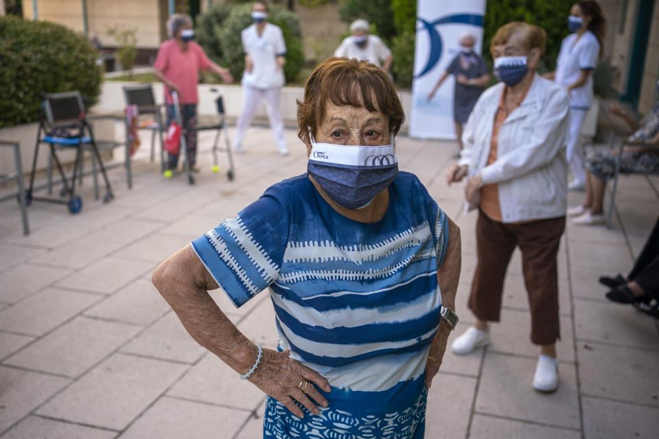 Hipolita, 96, takes part in a dance class at the Orpea Buenavista nursing home in Madrid, Spain, Thursday, Aug. 12, 2021. Once almost all of the elderly have been vaccinated, some residences are resuming some of the activities they organized before COVID, but maintaining a safe distance and wearing masks. (AP Photo/Andrea Comas)