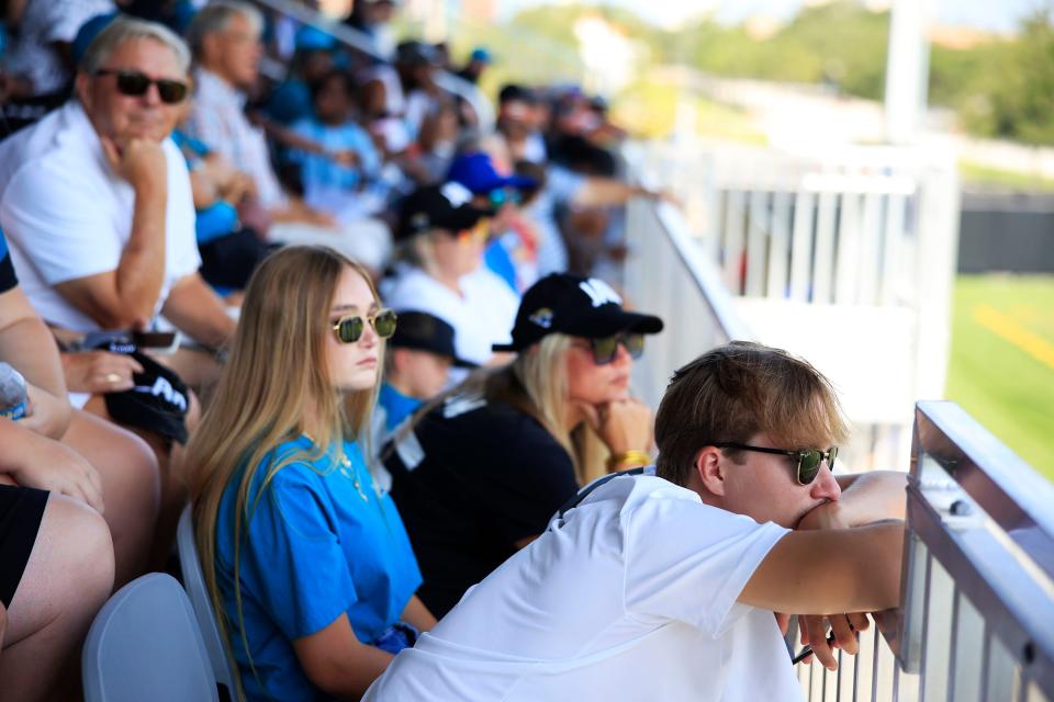 Brooks Boudreau leans on a rail as he watches the Jaguars practice on Wednesday at Miller Electric Center.