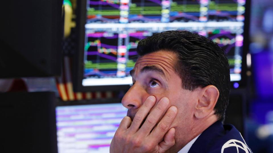 FILE - In this Aug. 12, 2019, photo specialist Peter Mazza works at his post on the floor of the New York Stock Exchange. Stocks of companies that do lots of business with China are obvious targets to sell when trade worries rise, and they’ve lagged sharply behind the rest of the market whenever President Donald Trump sends out a tariff tweet. But investors are also looking way beyond these first-order effects, as they pick out which stocks look most vulnerable to the trade war.