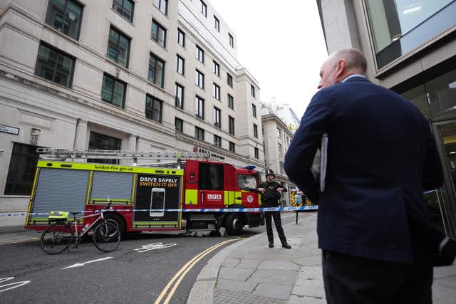 Firefighters in Old Jewry St in London after a fire broke out at the Lothbury restaurant