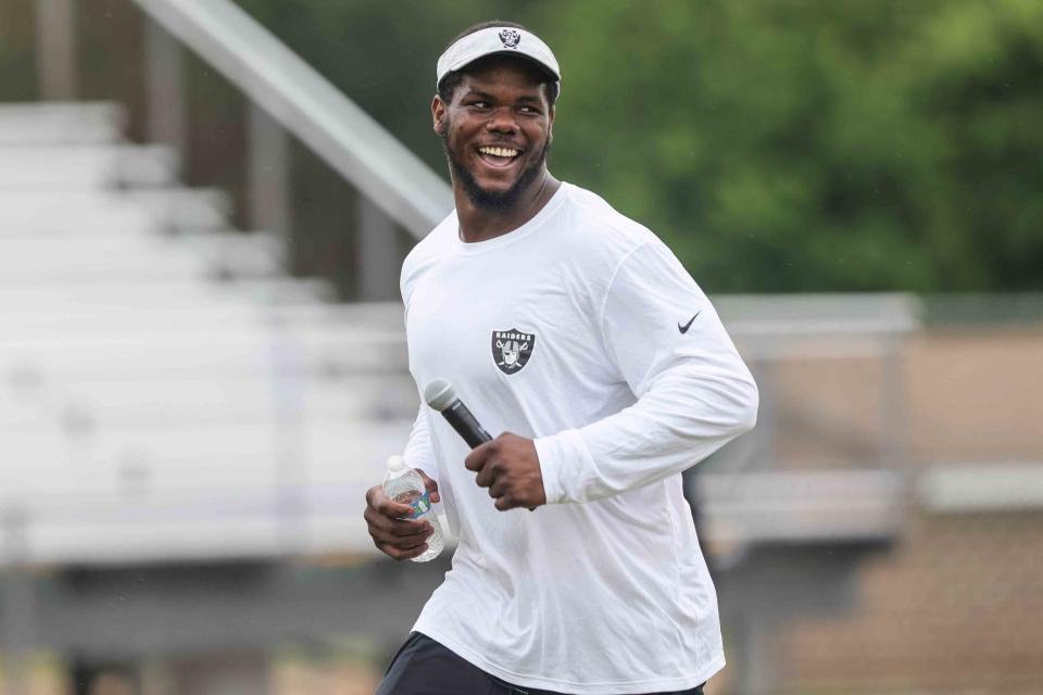 Las Vegas Raiders defensive tackle Bilal Nichols having a laugh during Nichols' BamFam Foundation football camp in the summer of 2021 at Hodgson Vo-Tech's football stadium