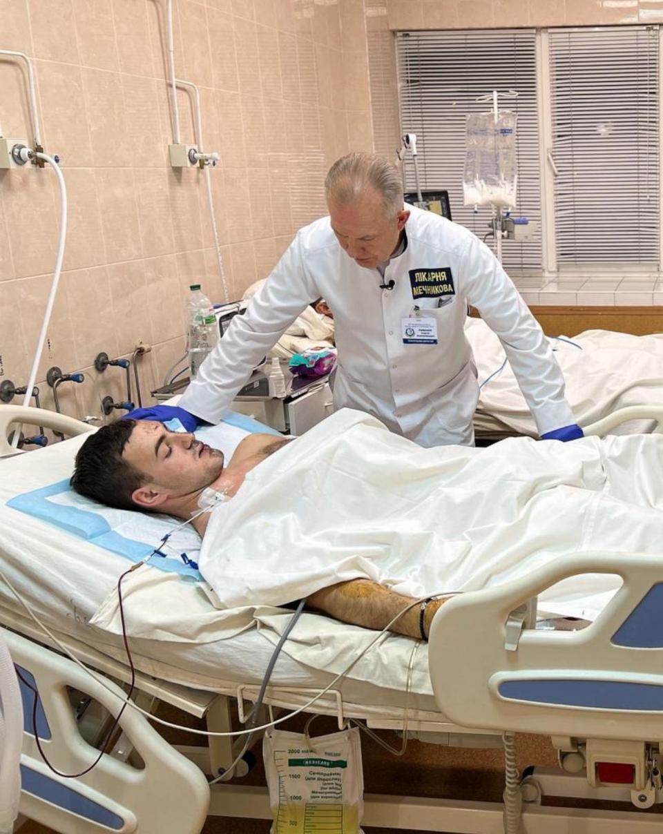 PHOTO: Dr. Sergii Ryzhenko speaks to Nazar, a patient at Mechnikov Hospital, in Dnipro, Ukraine, in a photo taken in January 2024 amid the Russian invasion of Ukraine. (ABC News)