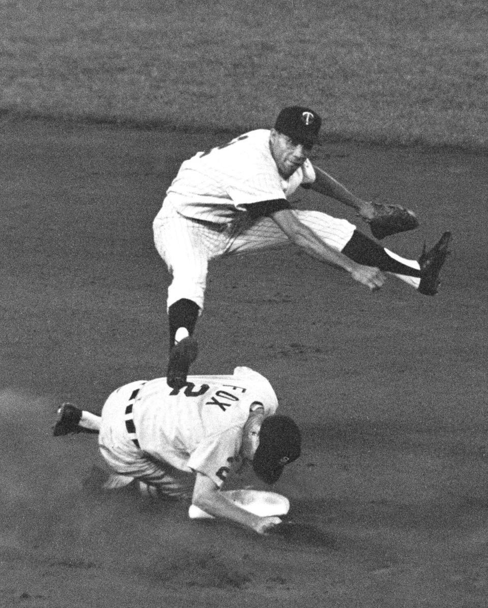 A man throwing a baseball