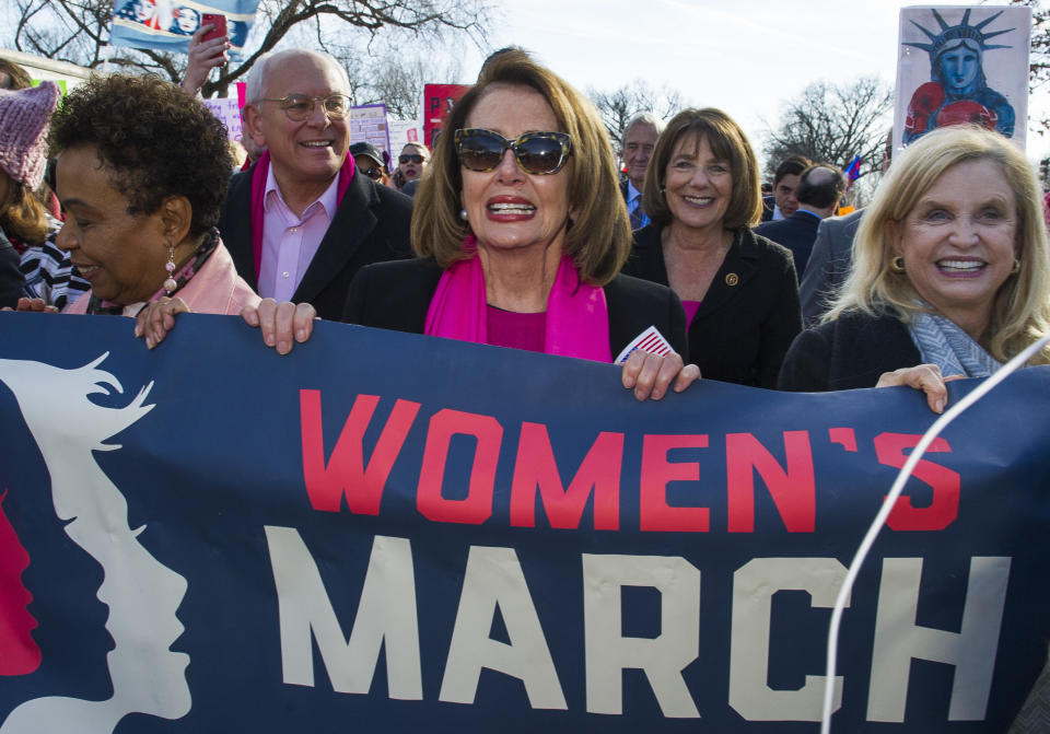 <p>House Minority Leader Nancy Pelosi, center, Rep. Susan Davis, background center right, and Rep. Carolyn Maloney, right, participate in the Women’s March walk to the White House in Washington, Saturday, Jan. 20, 2018. (Photo: Cliff Owen/AP) </p>