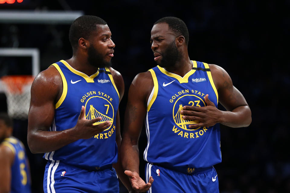 Draymond Green #23 and Eric Paschall #7 of the Golden State Warriors in action against the Brooklyn Nets  at Barclays Center on February 05, 2020 in New York City. 