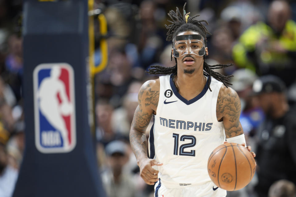 FILE - Memphis Grizzlies guard Ja Morant (12) plays in the second half of an NBA basketball game Friday, March 3, 2023, in Denver. The NBA has suspended Memphis Grizzilies guard Ja Morant eight games without pay, after determining that his holding a firearm at a club in suburban Denver earlier this month was “conduct detrimental to the league.” Morant will miss his sixth game on Wednesday, March 15, 2023, when the Grizzlies play in Miami.(AP Photo/David Zalubowski, File)