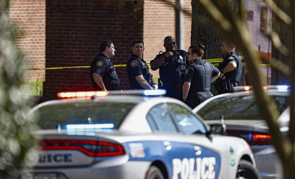 FILE - Knoxville police work the scene following a shooting at Austin-East Magnet High School in Knoxville, Tenn., Monday, April 12, 2021. Mass shootings at schools have prompted a growing number of states to encourage the creation of digital maps of facilities to aid emergency responders. An Associated Press analysis found that governors and lawmakers in more than 20 states have enacted or proposed measures setting standards for digital school mapping. (AP Photo/Wade Payne, File)