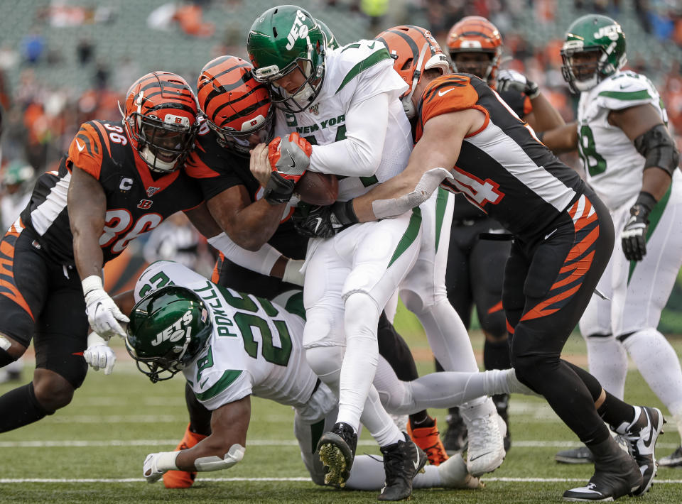 CINCINNATI, OH - DECEMBER 01: Sam Darnold #14 of the New York Jets is sacked by a host of Cincinnati Bengals defenders during the second half at Paul Brown Stadium on December 1, 2019 in Cincinnati, Ohio. (Photo by Michael Hickey/Getty Images)