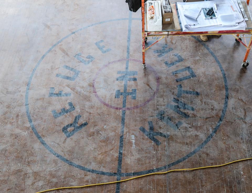 The gymnasium floor nods to one of the past congregations that called the church building at 600 E. Market Street home.