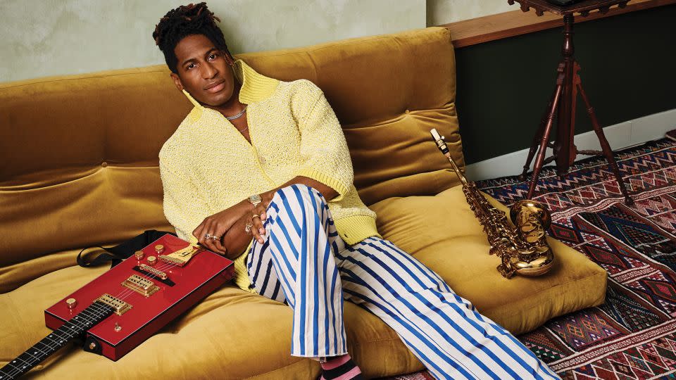 Jon Batiste pictured in the studio lounge of the Brooklyn home he shares with author Suleika Jaouad. - Frank Frances/Architectural Digest