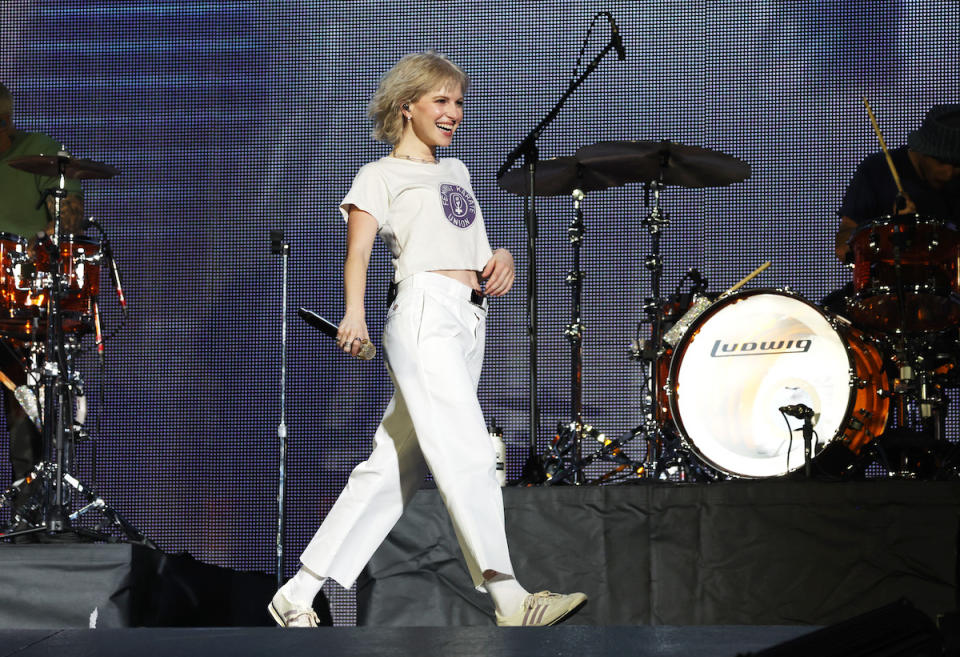  Hayley Williams of Paramore opens for "Taylor Swift | The Eras Tour" in athletic shoes at La Defense on May 09, 2024 in Paris, France. )
