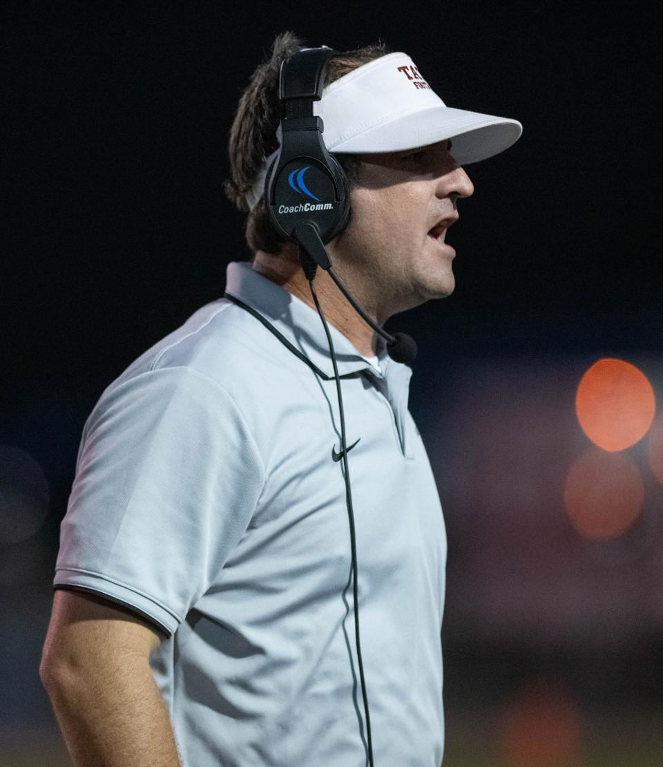 Aggies head coach Rhett Summerford shouts to his players during the Northview vs Tate football game at Tate High School in Cantonment on Thursday, Sept. 7, 2023.