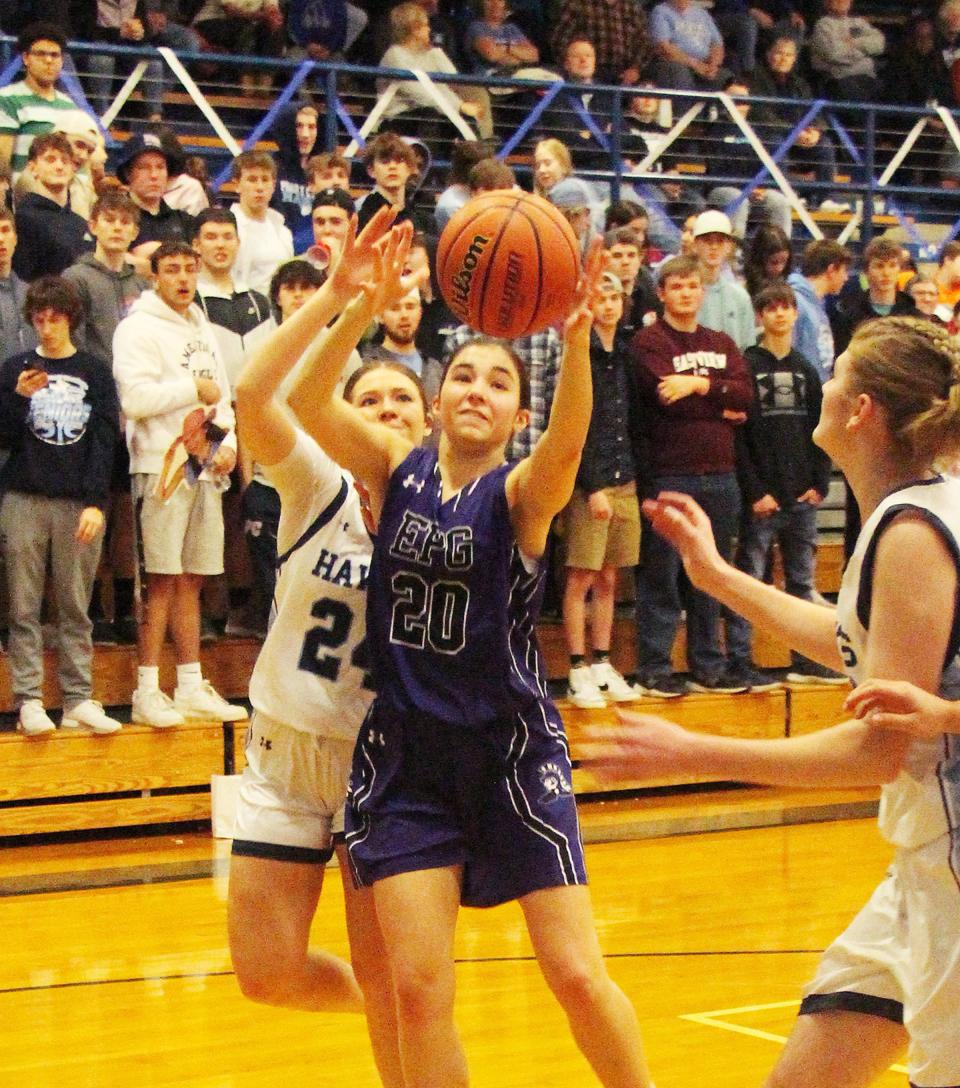 Madi Ehrhardt of El Paso-Gridley reaches for the ball between Prairie Central's Sawyer Ashman, left, and Kelly Wilkey in their nonconference game Thursday in Fairbury.