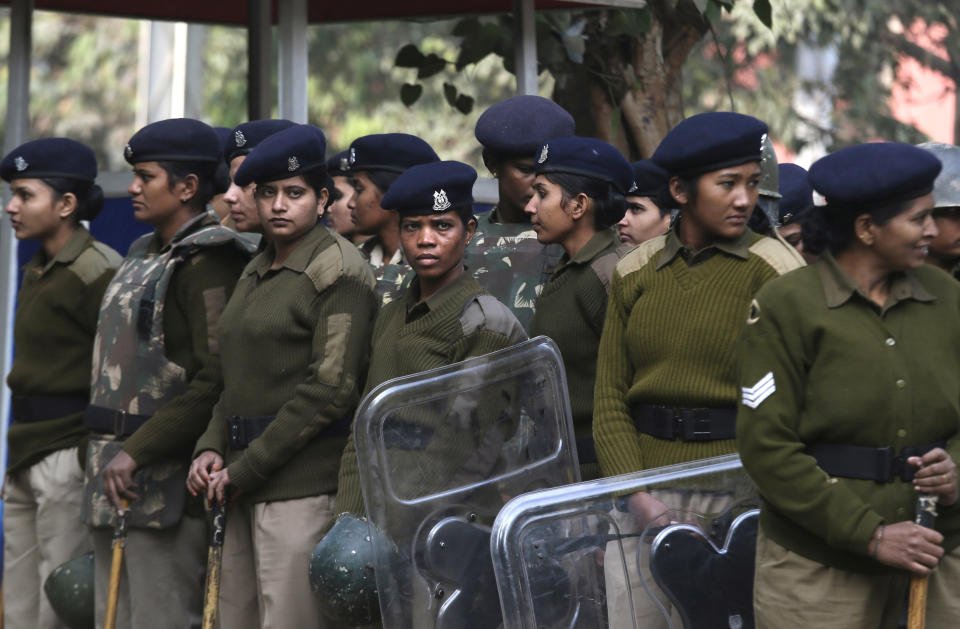 Indian policewomen stand guard during a protest in New Delhi, India, Monday, Dec. 31, 2012. (AP Photo/Manish Swarup)