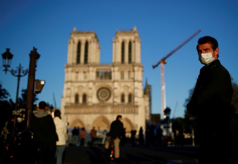 FILE PHOTO: Paris on lockdown marks one year anniversary of Notre Dame cathedral blaze