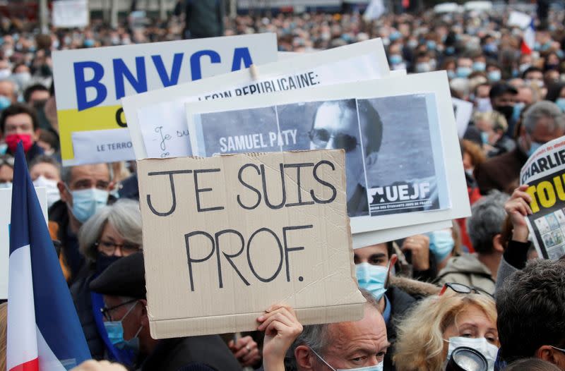 People pay tribute to beheaded teacher Samuel Paty in Paris