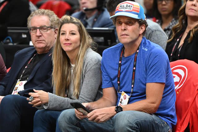 <p>Adam Hagy/NBAE via Getty</p> Jesse Itzler and Sara Blakely attend a sports game