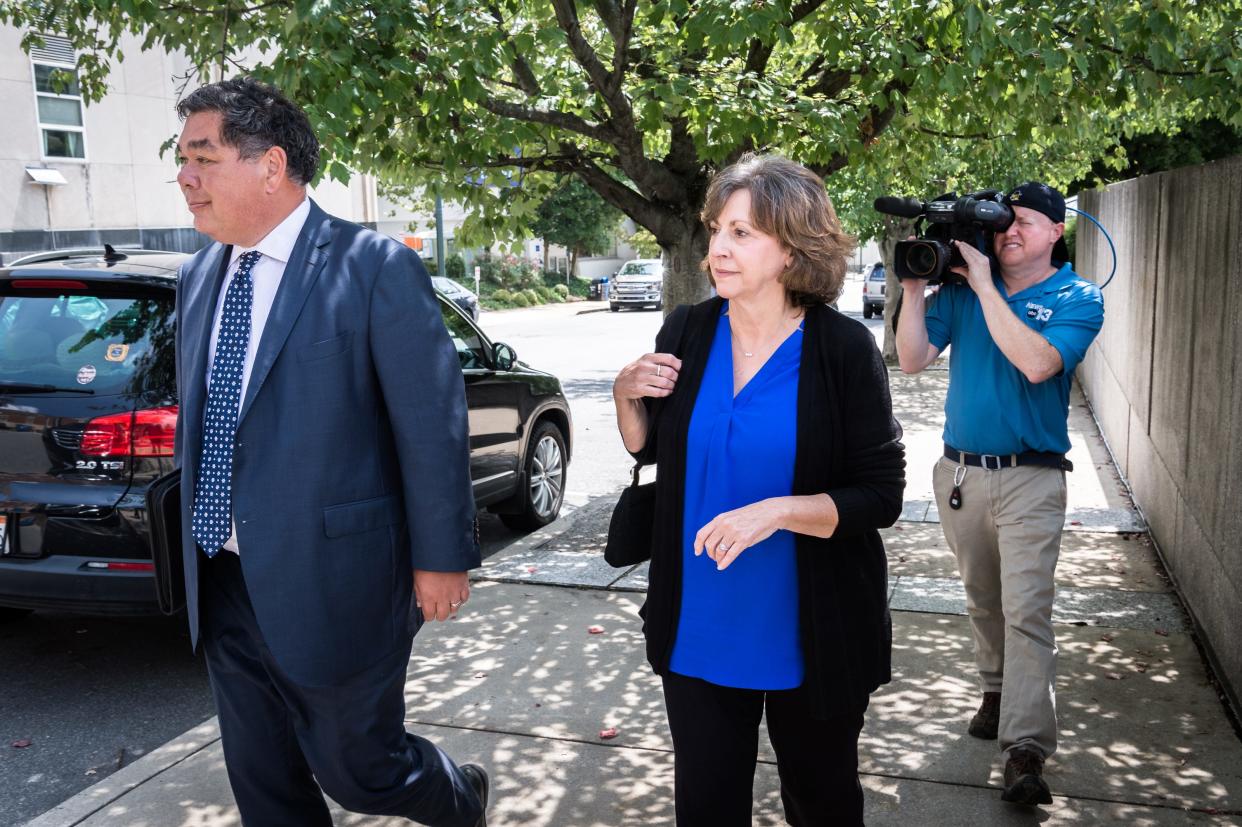 Wanda Greene, former Buncombe County manager, leaves the federal courthouse with her attorneys Noell Tin and Thomas Amburgey on Aug. 20, 2018.