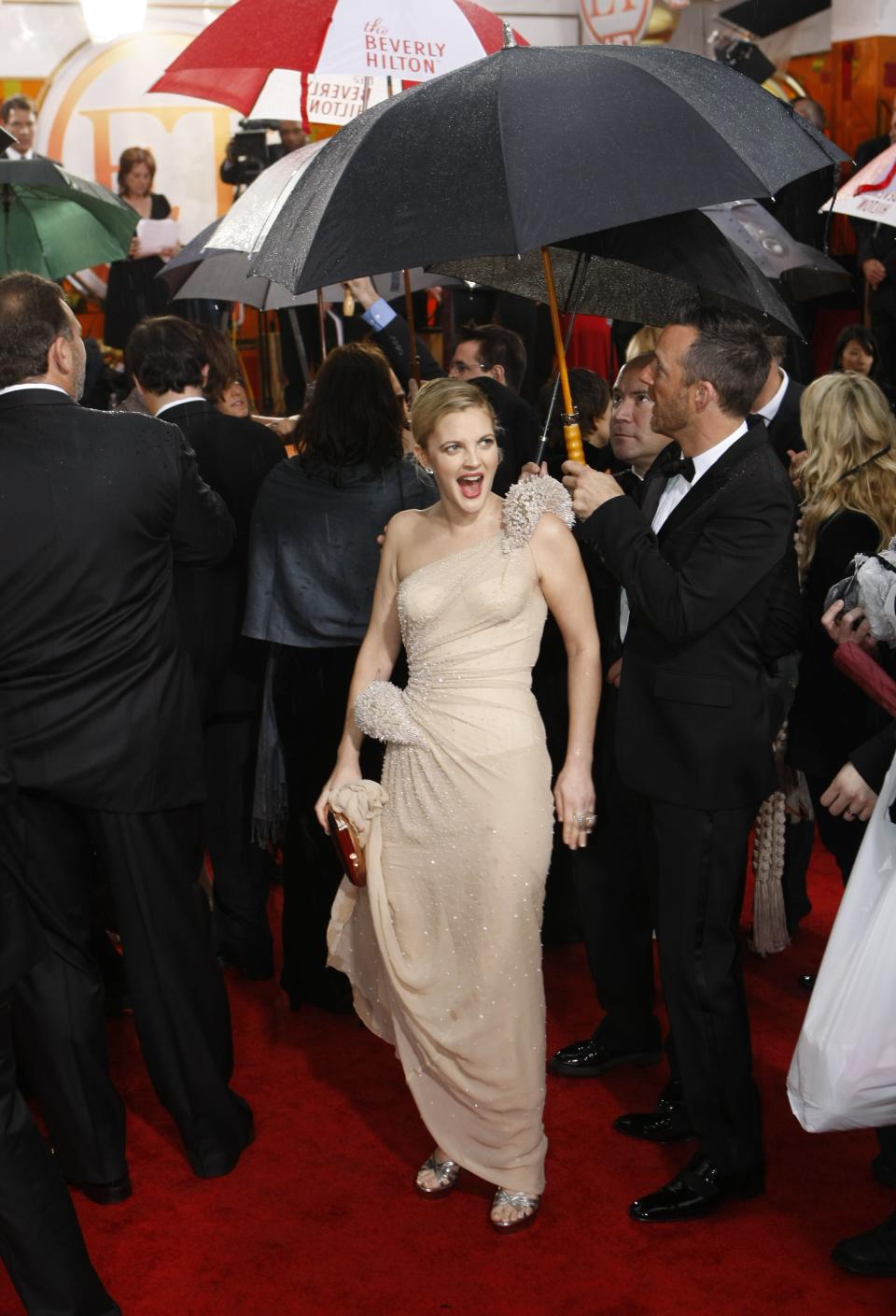 Drew Barrymore, who won her first Golden Globe at the 2010 awards for her role in <em>Grey Gardens</em>, posed pre-show in a sea of umbrellas. 
