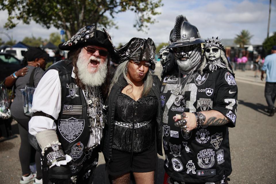 Jay "Capt. Jack Rackem" Levy, from left, of Tampa, Jaye Gullett of Hartsville, S.C., and "Hollywood Raider" of Greenville, S.C.  are shown in portrait while tailgating before a regular season NFL football matchup Sunday, Nov. 6, 2022 at TIAA Bank Field in Jacksonville. [Corey Perrine/Florida Times-Union]