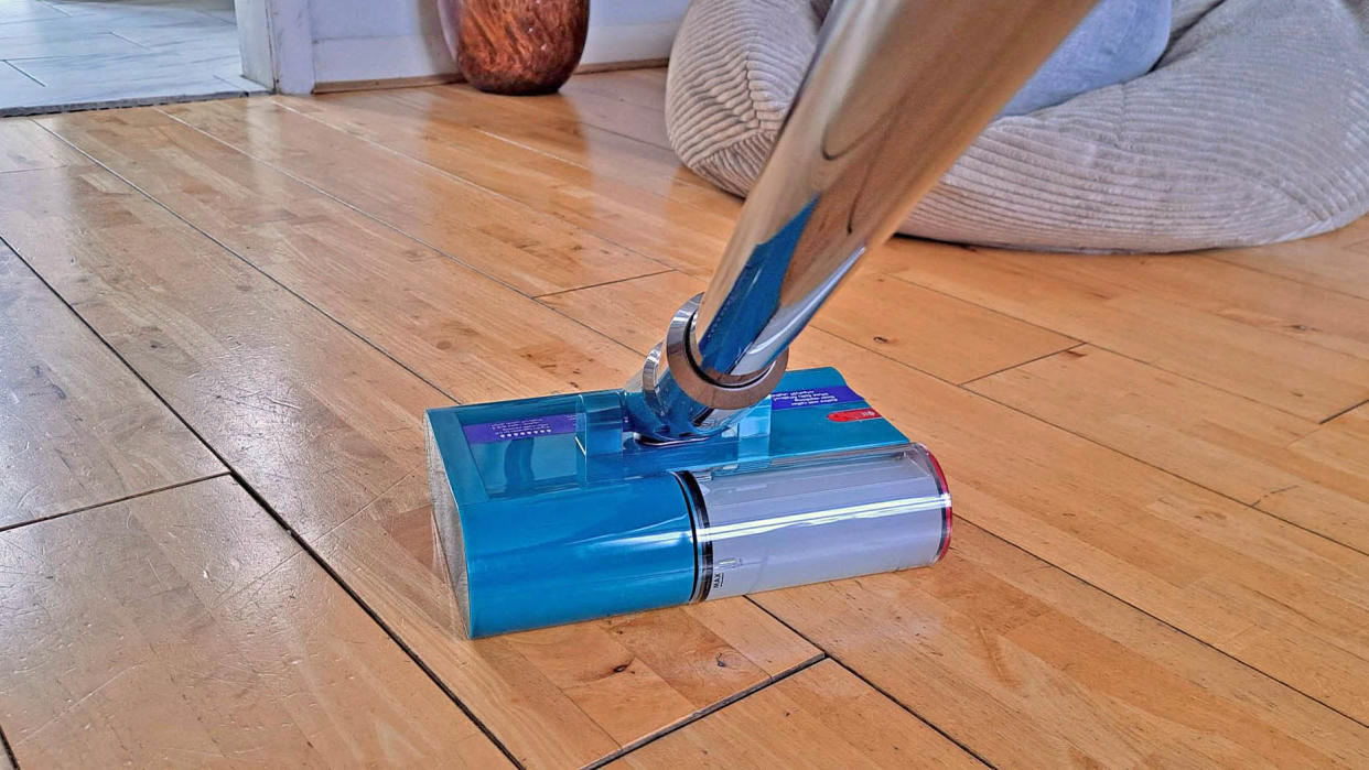  Dyson V15s Detect wet dry vacuum cleaner on hardwood floor. 