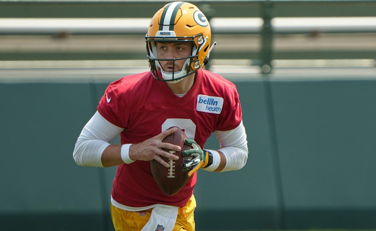 Green Bay Packers' Sean Clifford and Danny Etling throw during an