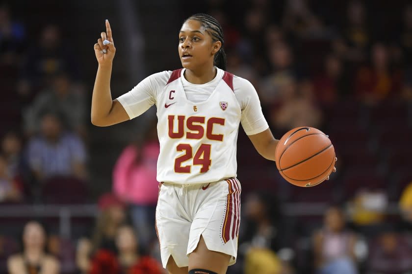 USC Trojans guard Desiree Caldwell brings the ball up the floor while playing the Virginia Cavaliers during an NCAA women's basketball game on Saturday, Nov. 9, 2019, in Los Angeles. (AP Photo/John McCoy)