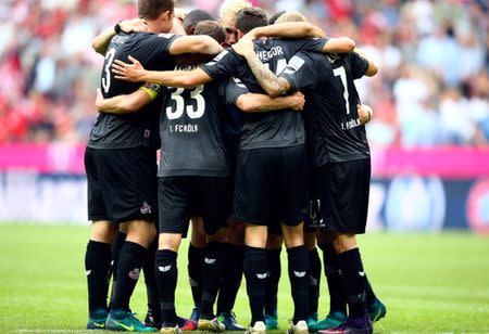 Football Soccer - Bayern Munich v 1. FC Cologne - German Bundesliga - Allianz-Arena, Munich, Germany - 01/10/16 Cologne players celebrate draw against Bayern Munich. REUTERS/Michael Dalder