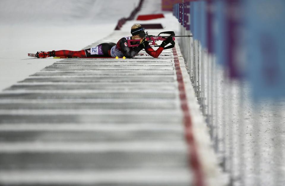 Canada's Zina Kocher shoots during the women's biathlon 7.5km sprint event at the 2014 Sochi Winter Olympics February 9, 2014. REUTERS/Stefan Wermuth (RUSSIA - Tags: SPORT OLYMPICS BIATHLON TPX IMAGES OF THE DAY) ATTENTION EDITORS: PICTURE 12 OF 25 FOR PACKAGE 'SOCHI - EDITOR'S CHOICE' TO FIND ALL IMAGES SEARCH 'EDITOR'S CHOICE - 09 FEBRUARY 2014'