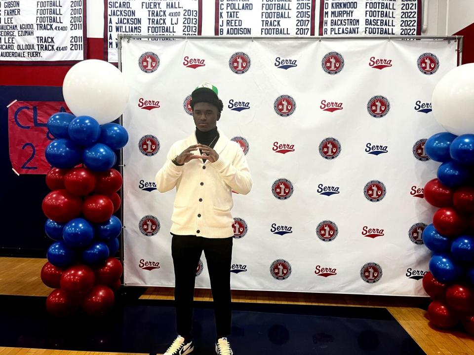 Gardena Serra senior Rodrick Pleasant gives the Oregon sign after committing to the Ducks.